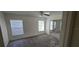 A tranquil bedroom with plenty of natural light from two windows and mirrored closet doors at 4906 Gifford Blvd, Orlando, FL 32821