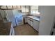 The kitchen offers essential appliances, and tile flooring for practicality and ease of maintenance at 4906 Gifford Blvd, Orlando, FL 32821