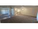 Spacious living room with neutral tones and flooring creates a bright and welcoming space at 4906 Gifford Blvd, Orlando, FL 32821