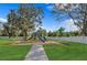 Community playground area with play structure on a mulch bed and grassy surroundings at 52 Overleaf Ln, Orlando, FL 32839