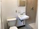 Functional bathroom featuring a classic vanity sink, toilet, and tiled shower at 530 Ruffel St, Maitland, FL 32751