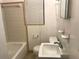 Small bathroom featuring a shower-tub combo, toilet, window, and vanity in a compact, efficient layout at 530 Ruffel St, Maitland, FL 32751