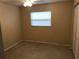 Cozy bedroom with neutral walls, carpet flooring, and closet space at 530 Ruffel St, Maitland, FL 32751