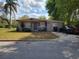 Charming single-story home featuring a well-maintained front yard, mature trees, and a driveway with parking at 530 Ruffel St, Maitland, FL 32751