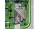 An aerial view of a house with a screened in pool, a fenced yard, and a lovely landscape at 543 Auburn Hill Blvd, Auburndale, FL 33823