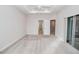 Spacious main bedroom with tray ceiling, neutral carpet, and an open layout, offering comfort and style at 543 Auburn Hill Blvd, Auburndale, FL 33823