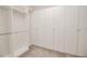 Spacious closet featuring built-in shelving and ample storage with wall-to-wall cabinets, perfect for organization at 543 Auburn Hill Blvd, Auburndale, FL 33823