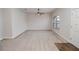 Inviting living room with carpet, a ceiling fan, and a side entry door at 543 Auburn Hill Blvd, Auburndale, FL 33823