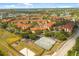 Expansive aerial view showcasing the entire community, amenities, and surrounding greenery at 5524 Metrowest Blvd # 210, Orlando, FL 32811