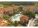 Beautiful aerial view of the community featuring a sparkling pool and well-maintained landscaping at 5524 Metrowest Blvd # 210, Orlando, FL 32811