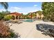 A lovely community pool with plenty of lounge chairs and a covered pavilion for residents to enjoy at 5524 Metrowest Blvd # 210, Orlando, FL 32811