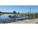 Scenic view of several pontoon boats docked on a serene lake, offering tranquil water activities at 6273 Toronja Dr, Indian Lake Estates, FL 33855