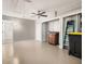 Well-organized garage with ceiling fan, storage and ample open space at 6273 Toronja Dr, Indian Lake Estates, FL 33855