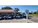 Row of golf carts at Indian Lake Estates Golf Course at 6273 Toronja Dr, Indian Lake Estates, FL 33855