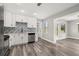 Contemporary kitchen featuring white cabinets, stainless steel appliances, and views to the yard at 6273 Toronja Dr, Indian Lake Estates, FL 33855