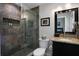 Modern bathroom with a glass shower, stone tile and granite countertop at 700 Bear Shadow Ct, Longwood, FL 32779