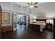 Spacious bedroom with French doors leading to a sunroom with lush backyard views at 700 Bear Shadow Ct, Longwood, FL 32779