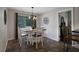 Comfortable dining area featuring a stylish table with seating and a view of the outdoor landscape at 700 Bear Shadow Ct, Longwood, FL 32779