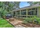 Back patio featuring a fire pit, seating, and expansive windows for natural light at 700 Bear Shadow Ct, Longwood, FL 32779