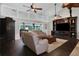 Open living room with hardwood floors, vaulted ceilings, and abundant natural light at 700 Bear Shadow Ct, Longwood, FL 32779