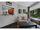 A cozy sitting area with a comfortable couch, coffee table, and pass-through to the kitchen, offering a relaxing space at 700 Bear Shadow Ct, Longwood, FL 32779