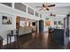 An open-concept living room boasts dark hardwood floors, stone accents, and seamless flow between spaces at 700 Bear Shadow Ct, Longwood, FL 32779