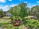 Expansive backyard featuring mature trees and a private wooden dock by the waterfront at 732 Wildmere Village Cv, Longwood, FL 32750