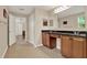 Bathroom with double sink vanity and view to bedroom featuring a tiled floor at 732 Wildmere Village Cv, Longwood, FL 32750