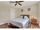 Comfortable bedroom featuring ceiling fan, neutral walls, and closet space at 732 Wildmere Village Cv, Longwood, FL 32750