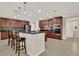 Bright kitchen featuring stainless steel appliances, a central island, and ample cabinet space at 732 Wildmere Village Cv, Longwood, FL 32750
