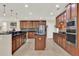Spacious kitchen with stainless steel appliances, granite countertops, and tile flooring throughout at 732 Wildmere Village Cv, Longwood, FL 32750