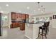 Spacious kitchen with granite countertops, stainless steel appliances, and beautiful wood cabinetry at 732 Wildmere Village Cv, Longwood, FL 32750