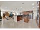 Open-concept kitchen with granite countertops, a center island, and seamless flow to the living area at 732 Wildmere Village Cv, Longwood, FL 32750
