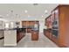 Modern kitchen featuring ample cabinet space, stainless steel appliances, and a large island at 732 Wildmere Village Cv, Longwood, FL 32750