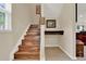 Elegant wooden staircase with natural light, adding charm and character to the home at 732 Wildmere Village Cv, Longwood, FL 32750