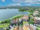 Expansive aerial shot of lakefront homes with scenic views, lush landscaping, and a serene atmosphere at 7613 Toscana Blvd, Orlando, FL 32819