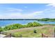 A beautiful backyard view showcases a serene landscape and distant lake at 7613 Toscana Blvd, Orlando, FL 32819