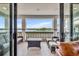 Balcony overlooking the lake with outdoor furniture and seating, with a lovely view of the water at 7613 Toscana Blvd, Orlando, FL 32819