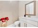 Half bathroom featuring decorative wallpaper and modern fixtures at 7613 Toscana Blvd, Orlando, FL 32819