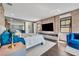 Bright bedroom features a large bed, modern furniture, and a large TV, enhancing its appeal at 7613 Toscana Blvd, Orlando, FL 32819