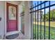 A front door with an intricate wrought iron window in a secure, gated entryway at 7613 Toscana Blvd, Orlando, FL 32819