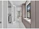 Hallway showcases natural light streaming in, with views of the bath and laundry areas at 7613 Toscana Blvd, Orlando, FL 32819