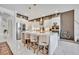 Modern kitchen with white cabinets, stainless steel appliances, a large island, and stylish decor, offering a clean aesthetic at 7613 Toscana Blvd, Orlando, FL 32819