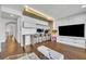 Contemporary living room area boasts a built-in study, hardwood floors and ample space for relaxing or entertaining at 7613 Toscana Blvd, Orlando, FL 32819