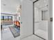 Open living space showcasing a sleek elevator, dining area, and a comfortable living room at 7613 Toscana Blvd, Orlando, FL 32819