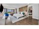 A stylish main bedroom with wood floors, a closet, and a serene view at 7613 Toscana Blvd, Orlando, FL 32819