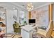 Modern office with white desk, unique lighting, and a decorative world map wall accent at 7613 Toscana Blvd, Orlando, FL 32819