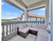 Cozy outdoor patio showcases comfortable seating with a view of the neighborhood and sunny skies at 7613 Toscana Blvd, Orlando, FL 32819