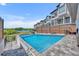 Enjoy the backyard pool with a view of the neighborhood and lake at 7613 Toscana Blvd, Orlando, FL 32819