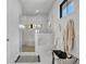 Modern shower showcasing marble tiles, a glass door, and contemporary fixtures, creating a spa-like experience at 7613 Toscana Blvd, Orlando, FL 32819